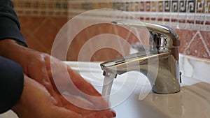 Man washing hands with soap