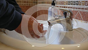 Man washing hands with soap