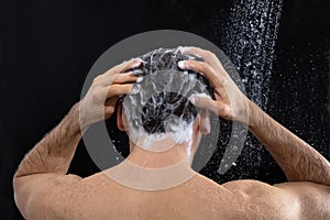 Man Washing Head And Hair With Shampoo