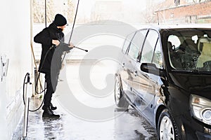 The man washing his car on self-service car wash. Express Car Wash