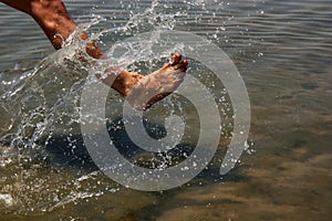 Man washing his foots in the beach