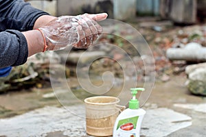 Man washing his hand using medicated hand wash