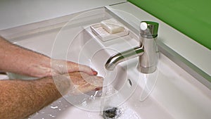 Man washing his Hands to prevent virus infection and clean dirty hands