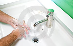 Man washing his Hands to prevent virus infection and clean dirty hands