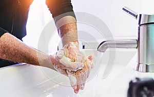 Man washing his Hands to prevent virus infection and clean dirty hands - corona covid-19 concept