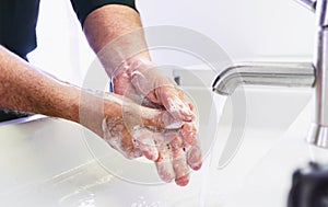 Man washing his Hands to prevent virus infection and clean dirty hands - corona covid-19 concept