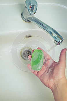 Man washing his Hands to prevent virus infection and clean dirty hands. /Man washes hands with soap