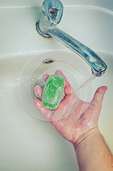 Man washing his Hands to prevent virus infection and clean dirty hands. /Man washes hands with soap