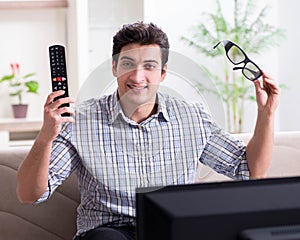 Man watching 3d tv at home