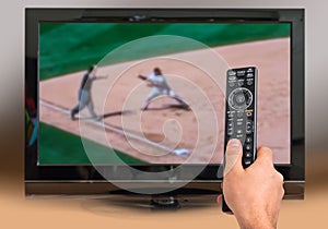 Man is watching baseball match on TV