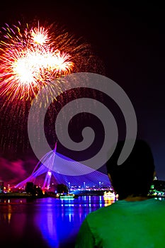 A man watching fireworks display