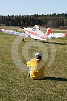 Man watching light aircraft