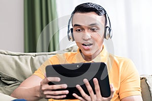Man watching movie on digital tablet