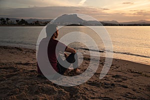 Man watching the sunset over the sea