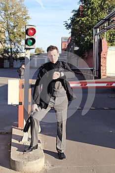 Man watching time by traffic light