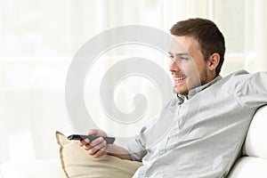 Man watching tv and zapping