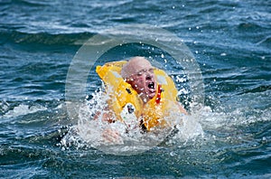 Man in water with life jacket on