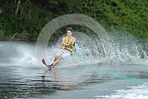 Man water skiing on lake