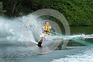 Man water skiing on lake