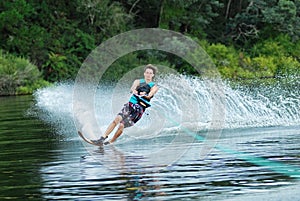 Man water skiing on lake