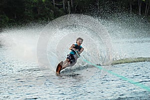 Man water skiing on lake