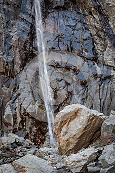 Man at waterfall in the mountains