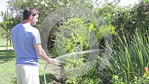 Man Watering Garden