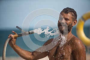 Man watering with hose