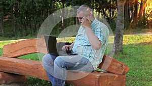 Man with watery eyes near laptop