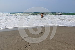 Man in waves in the Phillipines