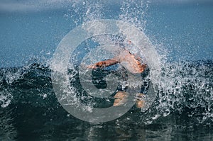 Man in waves of sea