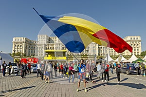 Man waving giant Romanian flag