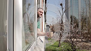 Man waving at the window