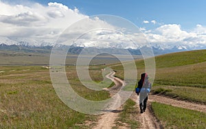 Man on way in steppe and Pamir mountains