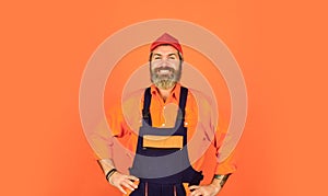 Man wear boilersuit. bearded worker in overalls. Confident Mature Mechanic. Portrait Of Repairman. Worker in storehouse