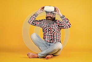 man wear wireless VR glasses. guy in VR headset. bearded hipster use modern technology. Digital future and innovation