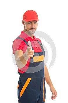Man wear working overall. handsome worker in uniform. building engineer pointing finger. mature skilled laborer in cap