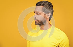 man wear yellow tshirt in studio, advertisement. photo of man wear yellow tshirt.