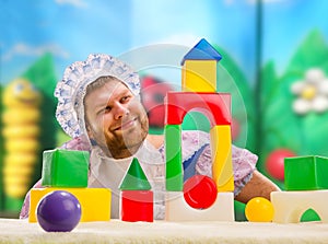 Man weared as baby play indoor