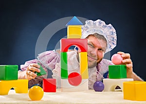 Man weared as baby playing