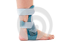 Man Wearing Ankle Support Brace in White Studio