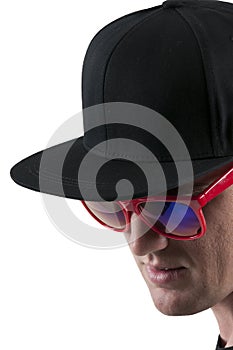 Man wearing baseball cap and sunglasses