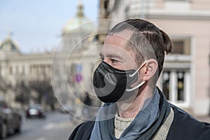 A man wearing a black face mask in Prague during the coronavirus pandemic.