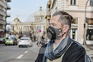 A man wearing a black face mask in Prague during the coronavirus pandemic.