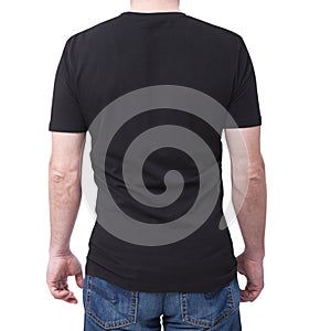 Man wearing blank bllack t-shirt isolated on white background with copy space. Tshirt design and people concept - close