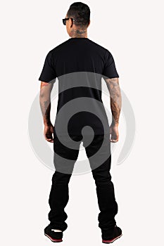 A man wearing blank plain t shirt  on white background. Hipster man with tattoo wearing black t shirt in back view