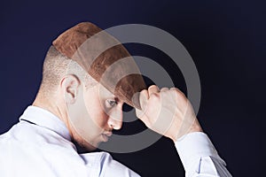 Man wearing a brown beanie profile