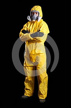 Man wearing chemical protective suit on background. Virus research