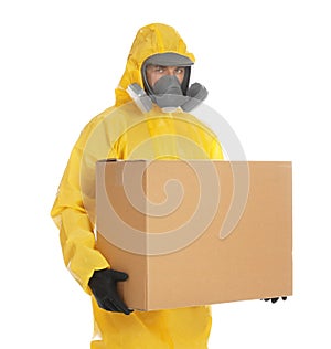 Man wearing chemical protective suit with cardboard box on background. Prevention of virus spread