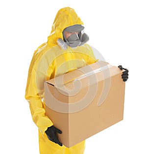 Man wearing chemical protective suit with cardboard box on background. Prevention of virus spread